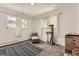 Bright bedroom with natural light, carpeted floors and a cat tree at 4653 S Lowell Blvd # E, Denver, CO 80236