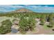 Stunning aerial view of the property with beautiful mountain views and lush landscaping at 3842 Estates Cir, Larkspur, CO 80118