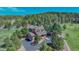 Beautiful home with a large yard and mature trees offering a private and serene setting at 3842 Estates Cir, Larkspur, CO 80118