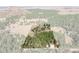 Aerial view of a private property surrounded by lush forest and scenic mountains at 3842 Estates Cir, Larkspur, CO 80118
