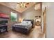 Comfortable bedroom with ample natural light and an oversized closet for storage at 3842 Estates Cir, Larkspur, CO 80118