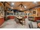 Unique dining room with wooden accents, a large table, and decorative stone pillars at 3842 Estates Cir, Larkspur, CO 80118
