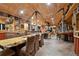 Spacious dining room with wooden table, unique rope decor, and stone accents at 3842 Estates Cir, Larkspur, CO 80118