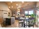 Bright kitchen with wood cabinets, an island, and a breakfast nook with mountain views at 3842 Estates Cir, Larkspur, CO 80118