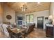 Cozy living room with a stone fireplace, wood ceiling, and comfortable seating at 3842 Estates Cir, Larkspur, CO 80118
