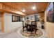 Recreation room with a wood paneled ceiling and walls, with a game table, carpet and window at 3842 Estates Cir, Larkspur, CO 80118