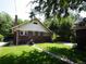Spacious backyard featuring a well-maintained lawn and patio area perfect for entertaining at 723 Steele St, Denver, CO 80206