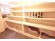 Basement cellar features built-in shelves, providing ample storage for wines at 723 Steele St, Denver, CO 80206