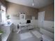 Well lit bathroom with a sink and vanity on the side at 723 Steele St, Denver, CO 80206