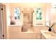 Bright, well designed bathroom with built-in cabinets, a vanity area, and lots of natural light at 723 Steele St, Denver, CO 80206