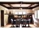 Bright dining room features coffered ceilings, built-in cabinets, and windows that let in lots of natural light at 723 Steele St, Denver, CO 80206