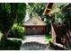 Detached two-car garage with a basketball hoop, surrounded by mature trees and greenery at 723 Steele St, Denver, CO 80206