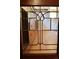 Detailed shot of a glass cabinet door showcasing intricate design and woodwork at 723 Steele St, Denver, CO 80206