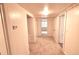 Spacious hallway with neutral carpeting, providing access to multiple rooms with classic white trim at 723 Steele St, Denver, CO 80206