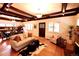 Open concept living and dining room with hardwood floors, coffered ceilings, and comfortable furniture at 723 Steele St, Denver, CO 80206