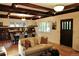 Inviting living room with hardwood floors, coffered ceilings, dining area, and natural light. Offers an open concept at 723 Steele St, Denver, CO 80206