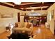 Spacious living room with hardwood floors, dining area, and coffered ceilings offers comfortable elegance at 723 Steele St, Denver, CO 80206