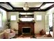 Cozy living room with a tiled fireplace and a comfortable seating area with lots of natural light at 723 Steele St, Denver, CO 80206