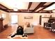 Stylish living room with hardwood floors, beamed ceilings, and an open layout at 723 Steele St, Denver, CO 80206