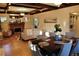 Bright, open living room featuring hardwood floors, fireplace, coffered ceilings, and dining area, perfect for entertaining at 723 Steele St, Denver, CO 80206