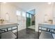 Spa-like bathroom with double vanity and large walk-in shower at 1920 Oneida St, Denver, CO 80220