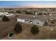 Aerial view of a well-maintained home with three car garage, mature trees and beautiful landscaping at 44011 Morning Star Ct, Elizabeth, CO 80107