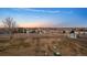 View of large fenced in backyard with sparse grass and a storage shed in the distance at 44011 Morning Star Ct, Elizabeth, CO 80107