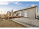 Home featuring a back deck, patio, and outdoor space with steps and an exterior entrance at 44011 Morning Star Ct, Elizabeth, CO 80107
