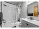 Stylish bathroom with a white marble-tiled shower, white toilet, and a modern vanity with chrome fixtures at 44011 Morning Star Ct, Elizabeth, CO 80107