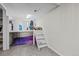 Carpeted bedroom features a modern loft bed with stairs and a cozy space beneath at 44011 Morning Star Ct, Elizabeth, CO 80107