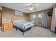 Cozy bedroom with a large bed and natural light at 44011 Morning Star Ct, Elizabeth, CO 80107