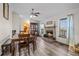 Open dining area features hardwood floors, a fireplace and lots of natural light at 44011 Morning Star Ct, Elizabeth, CO 80107