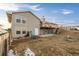 Home exterior with a deck, patio, ample backyard space, and multiple windows for natural light at 44011 Morning Star Ct, Elizabeth, CO 80107