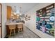 Spacious eat-in kitchen features tile floors, pendant lighting, and custom storage solutions at 44011 Morning Star Ct, Elizabeth, CO 80107