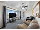 Bright living room with large bay windows, wood floors, and a clear view to other rooms at 44011 Morning Star Ct, Elizabeth, CO 80107