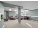 Spacious, carpeted living room with a large sectional sofa, recessed lighting, and bright, airy windows at 44011 Morning Star Ct, Elizabeth, CO 80107
