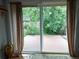 View to backyard deck through sliding glass doors with curtains, offering outdoor access at 4009 Wonderland Hill Ave, Boulder, CO 80304