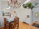 Charming dining room features a chandelier, a skylight, and beautiful wood floors at 4009 Wonderland Hill Ave, Boulder, CO 80304