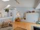 Inviting living room offers bright light with vaulted ceiling and decorative shelving at 4009 Wonderland Hill Ave, Boulder, CO 80304