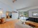 Open-concept living area features wood flooring, neutral decor, and sliding doors to the yard at 4009 Wonderland Hill Ave, Boulder, CO 80304