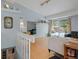 Sunlit living room with wood floors, neutral decor, and access to outdoor winter views at 4009 Wonderland Hill Ave, Boulder, CO 80304
