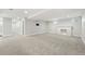 Spacious finished basement with plush carpet and a cozy fireplace at 474 S Vine St, Denver, CO 80209