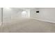 Finished basement with white trim, carpet, and a spot for the television at 474 S Vine St, Denver, CO 80209