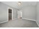 Neutral bedroom with grey carpet with walk in closet and neutral walls at 474 S Vine St, Denver, CO 80209