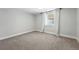 Modest bedroom with window, blinds, curtains, and carpeting at 474 S Vine St, Denver, CO 80209