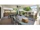 Inviting covered deck with a ceiling fan, outdoor furniture, and views of the surrounding neighborhood at 474 S Vine St, Denver, CO 80209