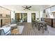 Spacious covered deck has outdoor seating, a dining table, and access to the home's interior at 474 S Vine St, Denver, CO 80209