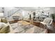 Spacious living area featuring hardwood floors, an open staircase, and a combined dining and kitchen space at 474 S Vine St, Denver, CO 80209