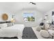 Bright main bedroom with vaulted ceiling, large windows, and stylish furnishings at 474 S Vine St, Denver, CO 80209