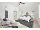 Bright main bedroom with vaulted ceiling, large windows, and stylish furnishings at 474 S Vine St, Denver, CO 80209